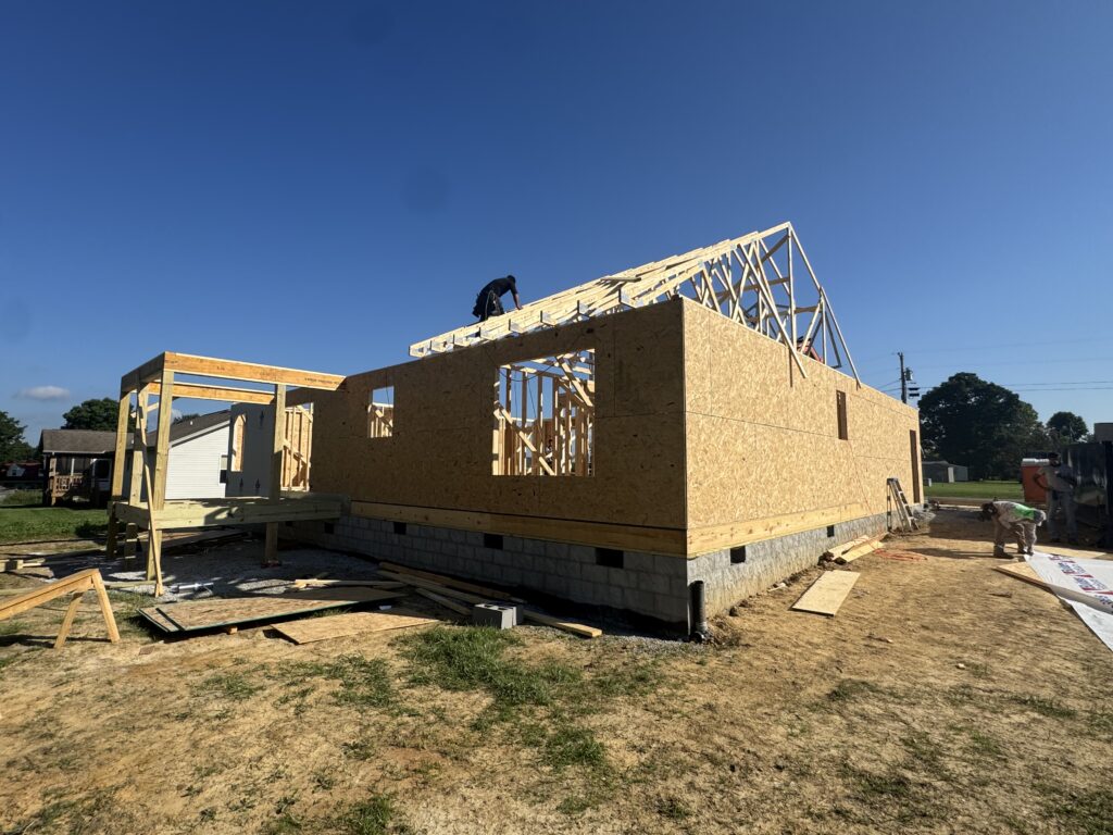 Construction crew framing the walls of a new home.